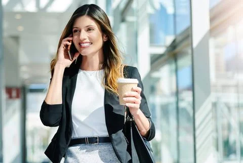 When success calls, answer. an attractive young businesswoman taking a a Stock Photos