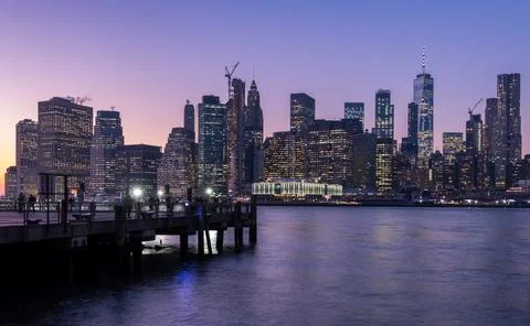 When the sun goes down, Manhattan city starts to shine and shows all its co.. Stock Photos
