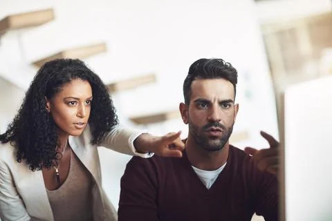When things go wrong, find a solution. young businesspeople in the office. Stock Photos