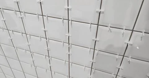 When tiling, a distance barrier device is used. Tile Spacer Stock Photos
