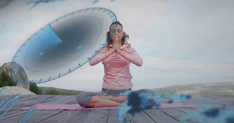 When translucent timer graphic rotates, yogi on pink mat holding prayer pose Stock Footage 315896018