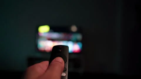 When using the remote control to change channels on a broadcasting platform Stock Footage 249470038