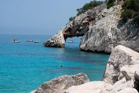 When visiting this beach, youll be amazed by its natural rock arch and the .. Stock Photos