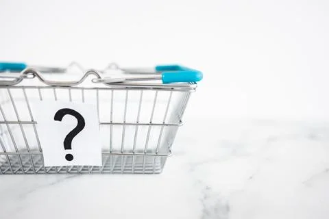 When will inflation go down. shopping basket with question mark in front of.. Stock Photos