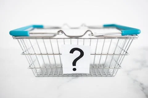 When will inflation go down. shopping basket with question mark in front of.. Stock Photos