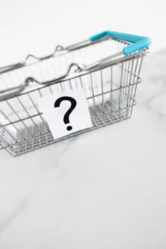 When will inflation go down. shopping basket with question mark in front of.. Stock Photos