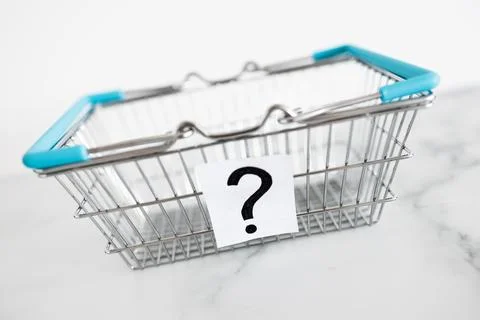 When will inflation go down. shopping basket with question mark in front of.. Stock Photos