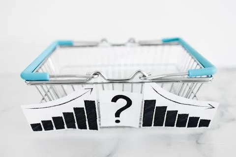 When will inflation go down. shopping basket with graph showing prices goin.. Stock Photos