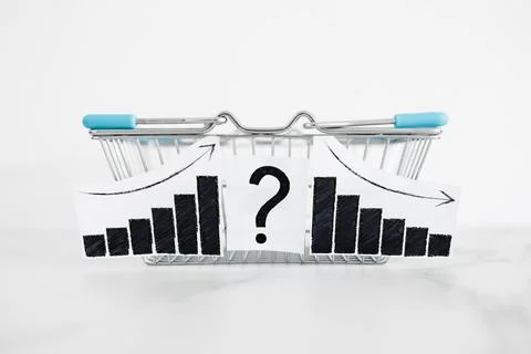 When will inflation go down. shopping basket with graph showing prices goin.. Stock Photos