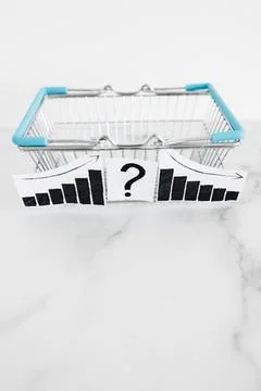 When will inflation go down. shopping basket with graph showing prices goin.. Stock Photos