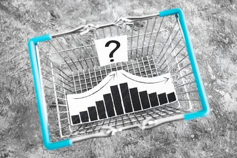 When will inflation go down. shopping basket with graph showing prices goin.. Stock Photos