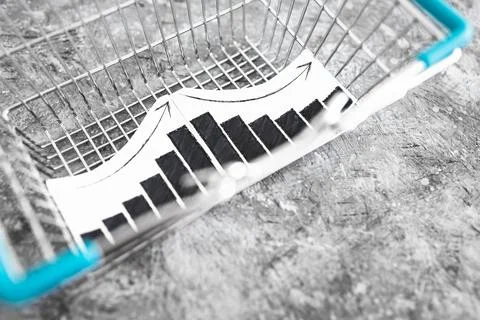 When will inflation go down. shopping basket with graph showing prices goin.. Stock Photos