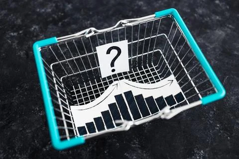 When will inflation go down. shopping basket with graph showing prices goin.. Stock Photos