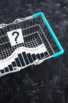 When will inflation go down. shopping basket with graph showing prices goin.. Stock Photos