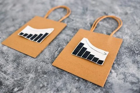 When will inflation go down. shopping bags with graph showing prices increa.. Stock Photos