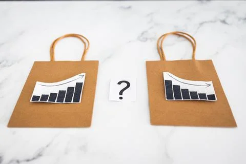 When will inflation go down. shopping bags with graph showing prices increa.. Stock Photos