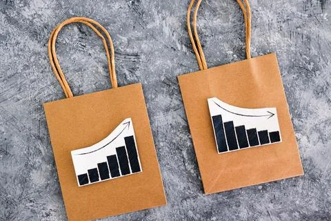 When will inflation go down. shopping bags with graph showing prices increa.. Stock Photos