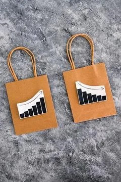 When will inflation go down. shopping bags with graph showing prices increa.. Stock Photos