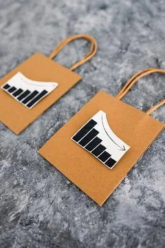 When will inflation go down. shopping bags with graph showing prices increa.. Stock Photos