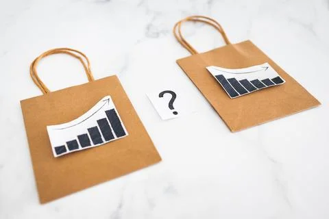 When will inflation go down. shopping bags with graph showing prices increa.. Stock Photos