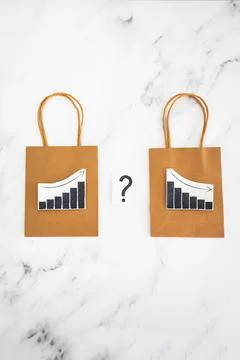 When will inflation go down. shopping bags with graph showing prices increa.. Stock Photos