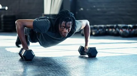 When you feel like quitting, push further. a young man doing push ups with Stock Photos