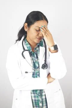 Where do doctors turn to when they feel down. a young doctor experiencing s.. Stock Photos