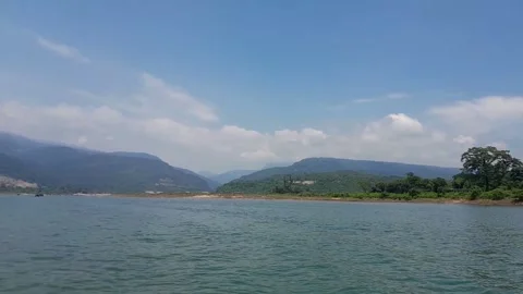 Where the River Meets the Sky: A Mountain View Video stock 283461453