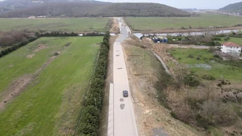 Where the Road Meets the River's Flow Stock-Footage 305667561