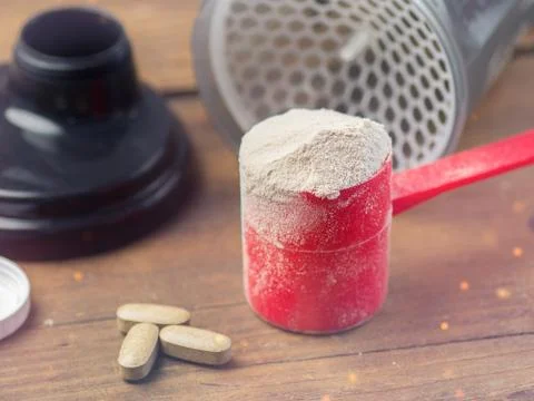 The whey protein in scoop Stock Photos