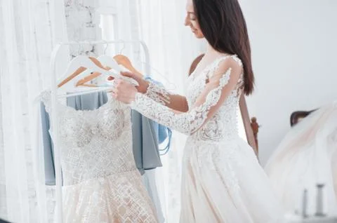 Which ones you like better. The process of fitting the dress in the studio of Stock Photos