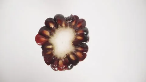 While the blackberry is rotating on a white background, I split it into two halv Stock Footage 248398489