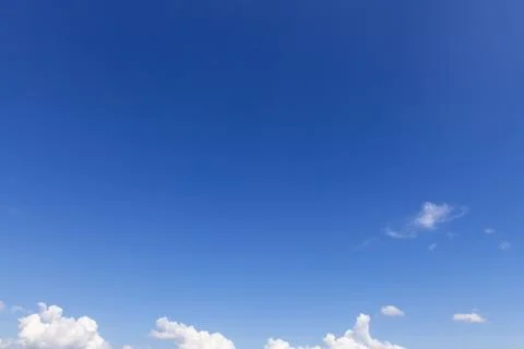 While Clouds over Blue Sky Background Stock Photos
