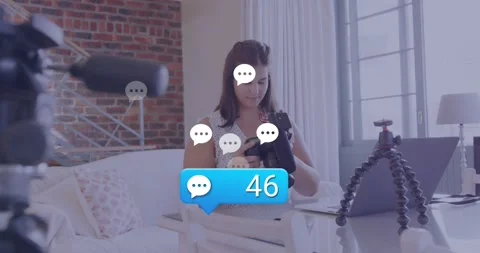 While comment bubble count climbing to 95 tech vlogger adjusting DSLR settings Stock Footage 319573425
