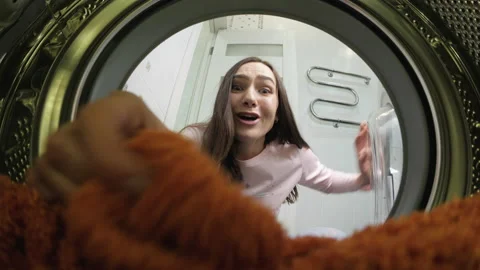 While doing household daily chores, a beautiful housewife after an unsuccessful Stock Footage 170234637