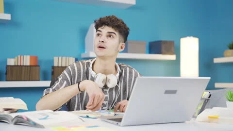 While doing the lesson, the thoughtful student comes up with an idea and rejoice 库存影片 237036737