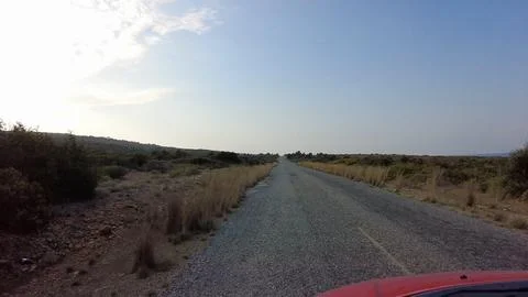While driving on the country road, there is no one else around. Stock Photos