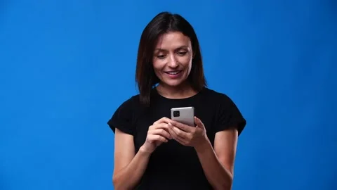 While flipping through the feed she received a notification and smiled Stock Footage 161644119