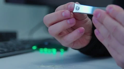 While having break an engineer cutting nails on a workplace Stock Footage 271065028