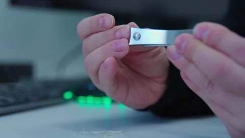 While having break a man cutting nails on a workplace Stock Footage 276925068