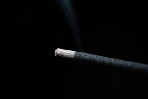 While the incense tip is on fire and smoking the smoke Stock Photos