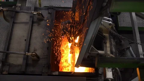 While melting metal in the factory Stock Footage 125523575