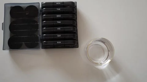 While pill organizers are convenient, relying on supplements isn’t the best choi Stock Footage 301105977