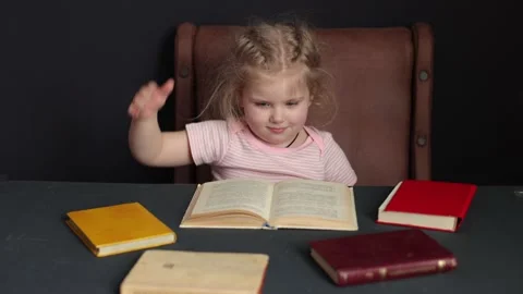 While preparing for school, the child studies at home. Distance learning Stockbeeldmateriaal 231056284