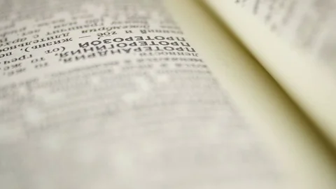 While reading encyclopedia.  Stock Footage 79750329