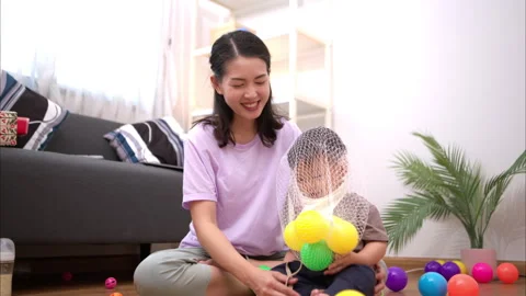 While in vacation at home, a mother engages in activities with little kid Stock Footage 310101656