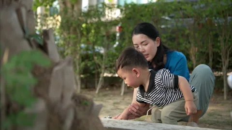 While in vacation at home, a mother engages in activities Stock Footage 310104409