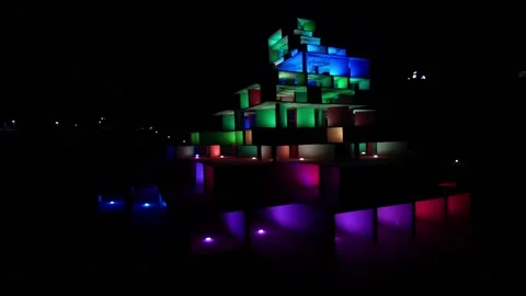 Whimsical art installation glows in different colors at night 動画素材 162875423