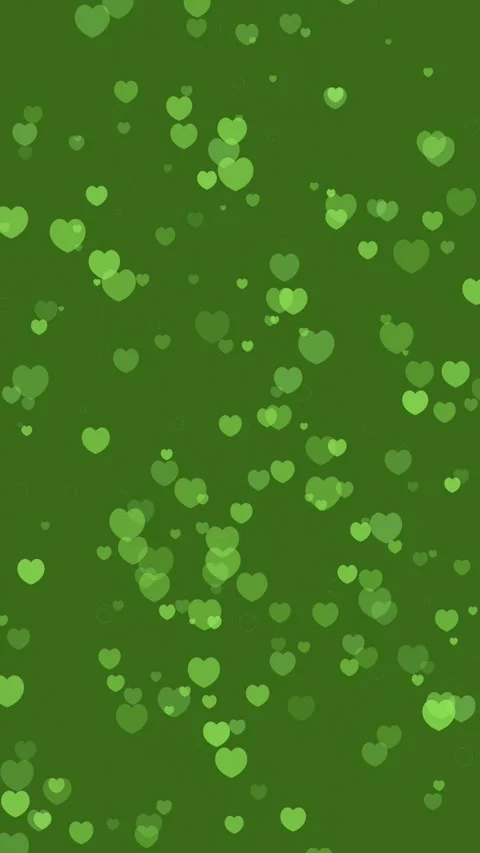 Whimsical Heart Shapes Float on Green Background Stock Footage 327942388