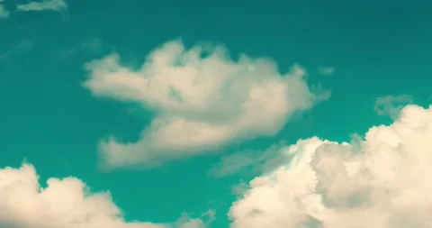 Whimsical transformations of white clouds against a blue sky. 스톡 동영상 146535087